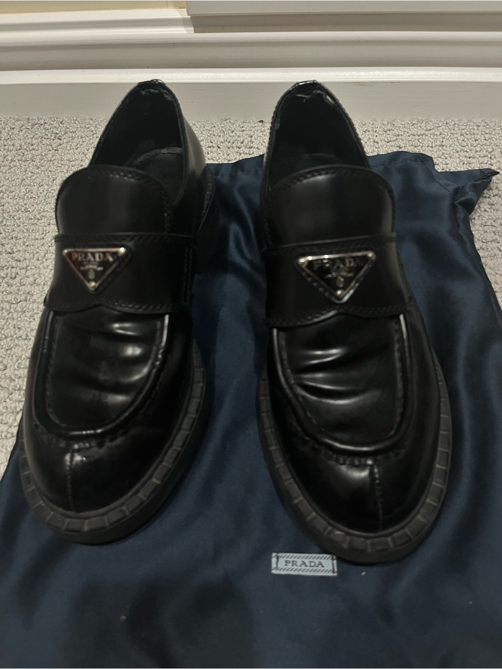 Prada Black Leather Penny Loafers with Triangular Logo Plaque